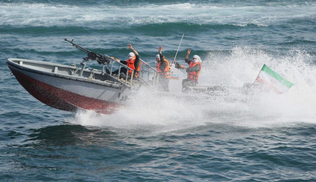 CORRECTING NAME OF THE GULF IN IPTC Members of Iran's elite Revolutionary Guard flash a victory sign as they carry naval exercises in the Gulf on April 22, 2010. Iran's elite Revolutionary Guards launched a new "ultra-fast" boat capable of causing high destruction after testing it in a key oil supply route, at the start of a three-day military drill.  AFP PHOTO/FARS NEWS/MEHDI MARIZAD (Photo credit should read MEHDI MARIZAD/AFP/Getty Images)