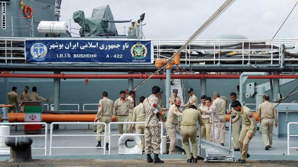 Iranian navy personnel stand aboard the IRIS Bushehr as two Iranian warships docked in the Sudanese Red Sea city of Port Sudan on December 8, 2012. The Iranian navy said the 1,400 ton frigate Jamaran and the 4,700 ton support ship Bushehr "docked in Port Sudan, after successfully carrying out their assignments in the Red Sea and were greeted by high-ranking Sudanese naval commanders." Khartoum said it was a "normal" port call but Israeli officials have expressed concern about arms smuggling through Sudan. AFP PHOTO/STR        (Photo credit should read STR/AFP/Getty Images)