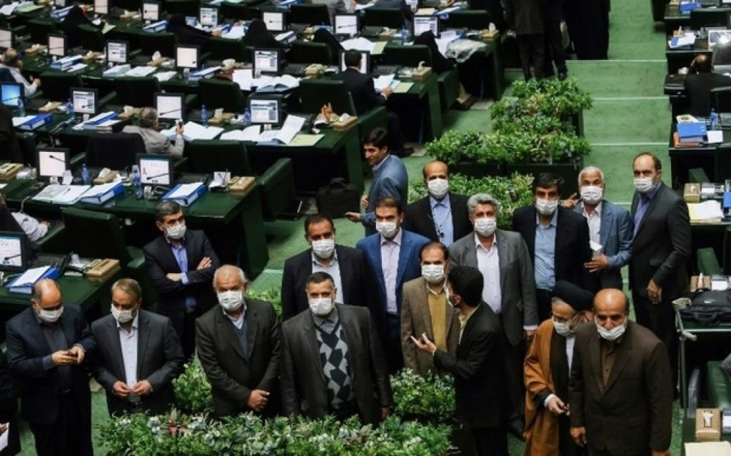 Some of the Iranian parliament's law makers wear masks during a parliament session to show their solidarity with the residents of the city of Ahwaz that has been hit by sandstorms in recent days, on February 15, 2015 in Tehran.  AFP PHOTO / ISNA / AMIR POURMAND / AFP PHOTO / ISNA / AMIR POURMAND